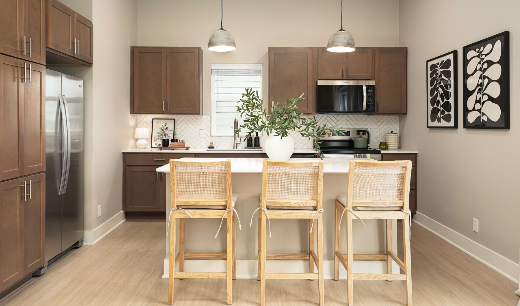 a kitchen with brown cabinets